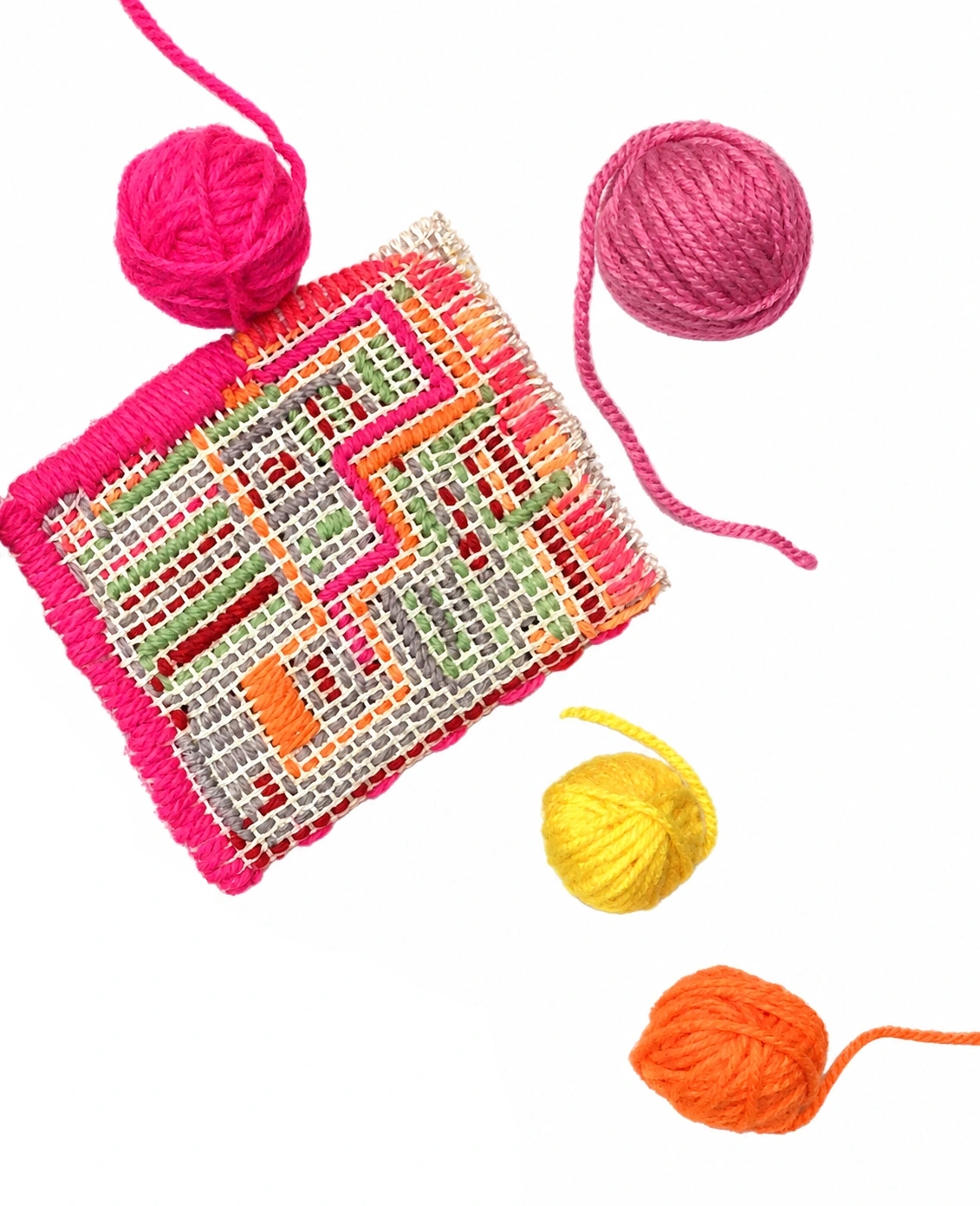 Hand-stitched fabric and colourful yarn
